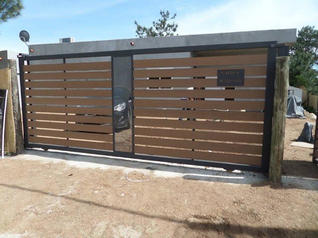 porton corredizo de hierro y madera